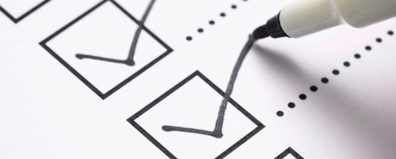 pen checking box on list